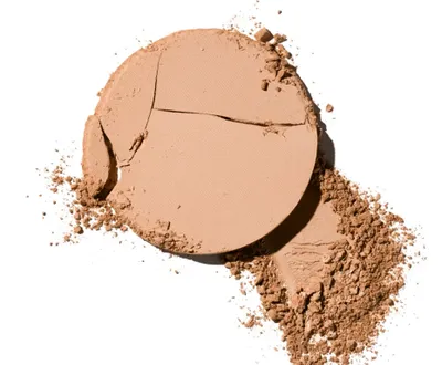 A broken compact of bronzing powder on a white background.