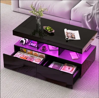 A modern black coffee table with LED lighting, placed in a living room setting with a sofa and rug.