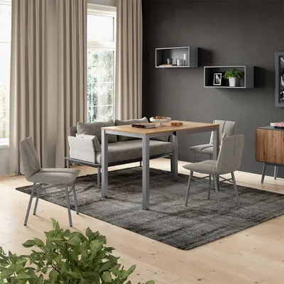 A dining set with a table and chairs in a modern living room setting.