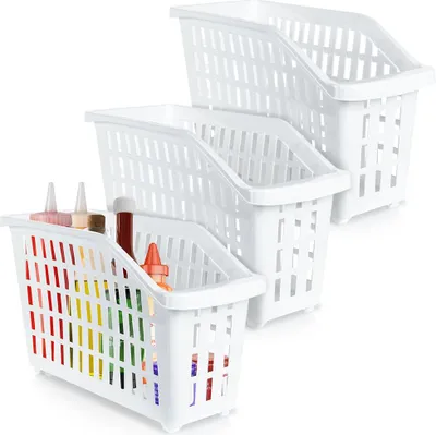 Three white plastic storage bins stacked on top of each other, with the front bin containing bottles of condiments.