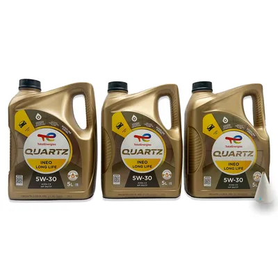 Three identical gold-colored oil canisters are arranged side-by-side against a white background. A small white cone-shaped object is placed to the right of the canisters.