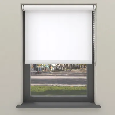 A white roller blind is shown in a window frame, with a blurred view of a street and grass outside.