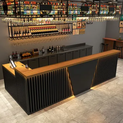 An L-shaped bar counter in a modern setting, possibly a restaurant or bar.