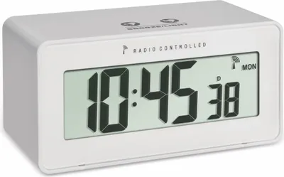 A white digital alarm clock with a digital display showing the time, date, and temperature.