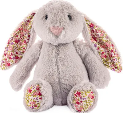 A plush bunny toy is sitting down, facing the camera.