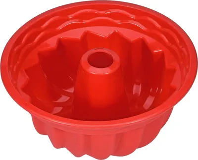 A red silicone bundt cake pan is shown against a white background.