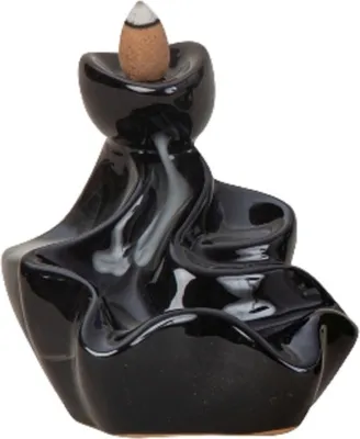 Dies ist ein schwarz lackierter Keramik-Räucherkerzenhalter in Form eines Wasserfalls.