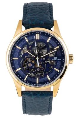 A close-up studio shot of a men's wristwatch with a skeleton dial and a blue leather strap.