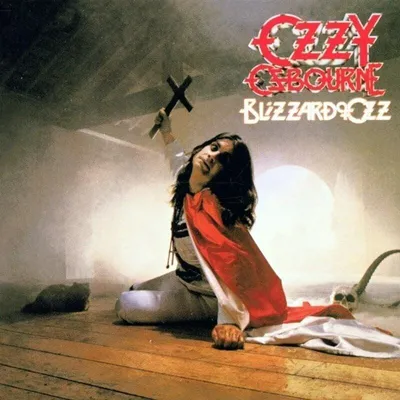 Ozzy Osbourne kneeling on a wooden floor, holding a cross, with a red cloth draped over him. A skull is visible on the right.