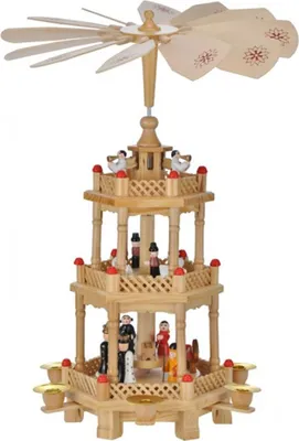 A wooden Christmas pyramid with multiple tiers and figures.
