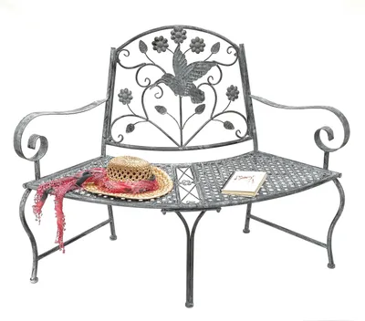 A metal garden bench with decorative elements.