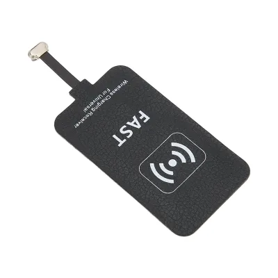 A black wireless charging receiver patch with a cable and connector.