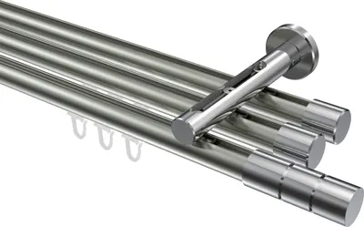A close-up, studio shot of a multi-track curtain rod system.