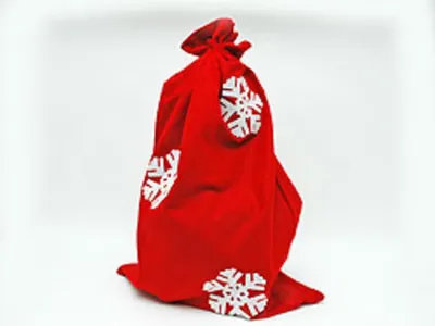 A red Christmas sack with white snowflake decorations against a white background.