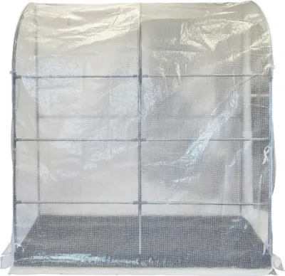 A transparent greenhouse tent covering a metal frame structure.