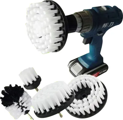 A cordless drill with a brush attachment and several other brush attachments are displayed against a white background.