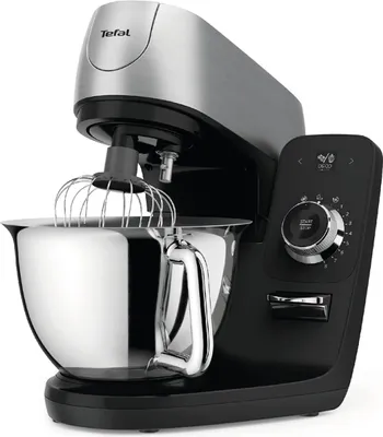 A black and silver Tefal kitchen mixer with a whisk attachment is shown against a white background.