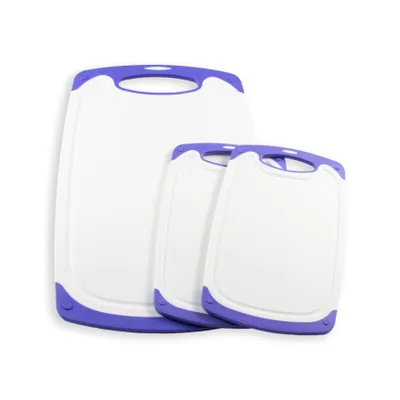 Three white cutting boards with purple trim are arranged in front of a white background.