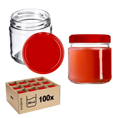 A collection of glass jars with red lids, some filled with a red substance, and a box containing multiple jars.