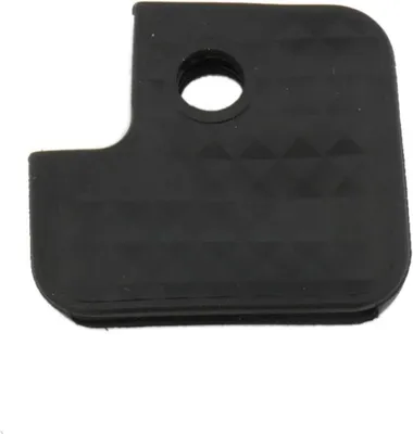 A black keycap with a textured surface and a hole in the corner.