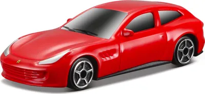 A red toy Ferrari car is shown from a slight diagonal angle against a white background.