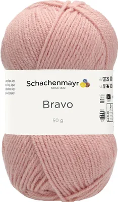 A ball of pink yarn with a label.