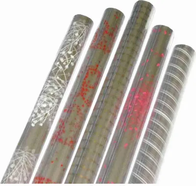 Produktbild von Sortiment Geschenkfolie Prisma - Klarsichtfolie mit Druck - bedruckte Transparentfolie - 45 Röllchen á 250 x 70 cm -Rolle: € 2,95 -gesamt: € 147,50