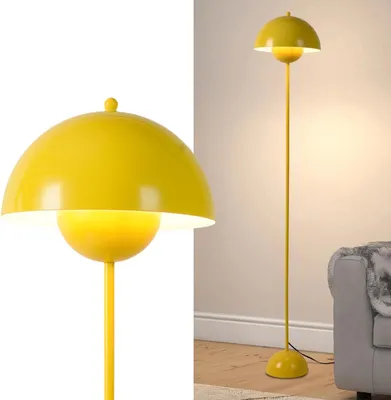 A yellow floor lamp is shown in a room with a gray sofa.