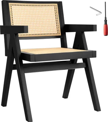 A black armchair with a woven cane back and seat, shown against a white background. Tools for assembly are visible in the upper right corner.