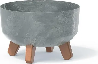A close-up studio shot of a planter pot with a concrete effect.
