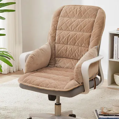 A khaki-colored office chair cushion with a quilted pattern is shown on an office chair.