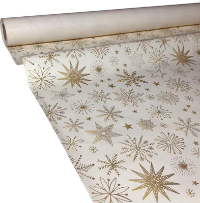 A roll of white paper with a gold snowflake and star pattern, partially unrolled.