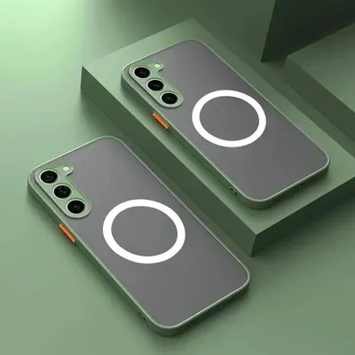 Two phone cases with magnetic rings for wireless charging are displayed on green platforms.