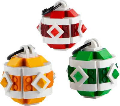 Three LEGO Christmas ornaments in red, green, and orange colors.