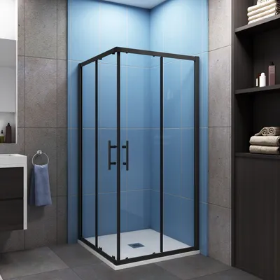 A modern bathroom with a black framed glass shower enclosure.