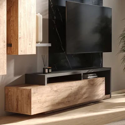 A modern living room setup featuring a TV stand and wall-mounted cabinets.