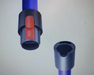 A 3D rendering of two parts of a vacuum cleaner tube, one with a red button.