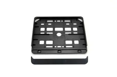 A black license plate holder and a separate black trim piece are shown against a white background.