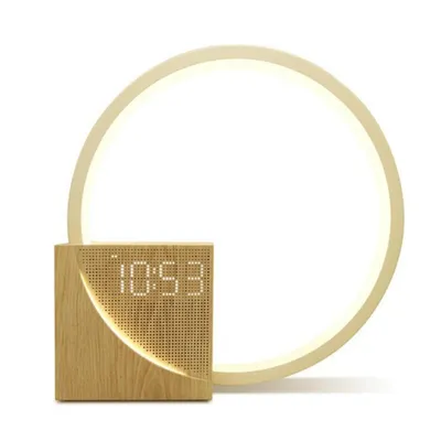 A wooden digital alarm clock with a circular light ring behind it, set against a white background.