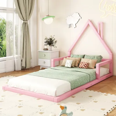 A child's bedroom with a pink house-shaped bed.
