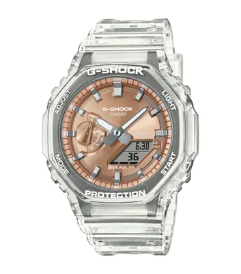 A clear, close-up studio shot of a transparent G-Shock watch with a rose gold face.
