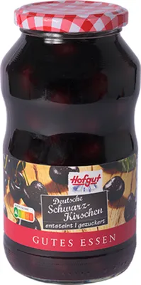 A jar of cherries on a white background with a label.