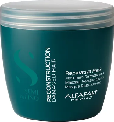A teal colored jar of hair mask with white text and branding.