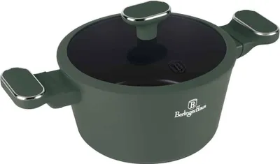 A green pot with a black lid and silver accents is shown against a white background.