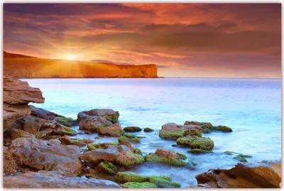 Produktbild von XXL Poster 100 x 70cm (F-215) Meereslandschaft mit SteilKüste und Sonnenschein - Steine am Strand (Lieferung gerollt!)