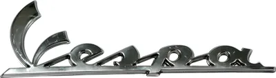 Produktbild von Schild / Schriftzug Vespa OEM für Beinschild für Vespa GT, LX, LXV, S, GTS, GTV