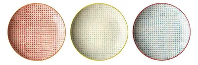 Three round plates with a dotted pattern, each in a different color.