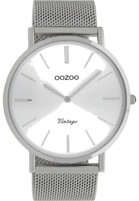 A close-up studio shot of a silver wristwatch with a white face.