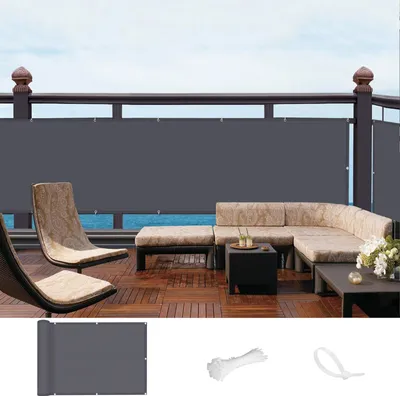 A balcony with outdoor furniture and a privacy screen.