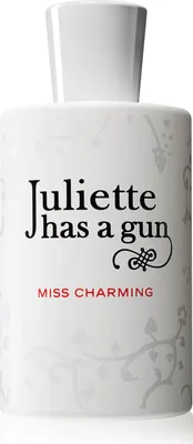 A white perfume bottle with black and red text.